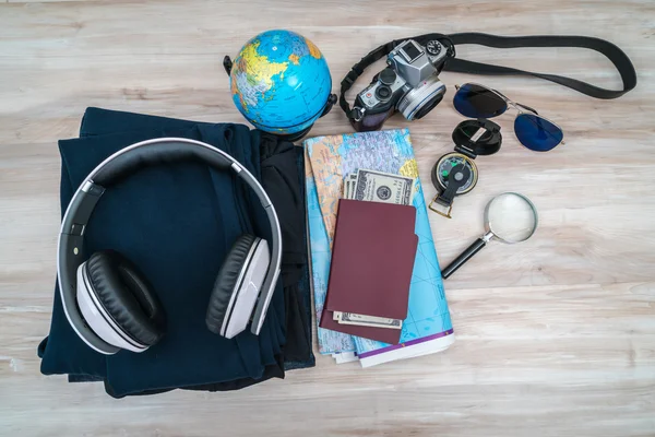 Travel preparation : compass, money, passport, road map ,sunglas