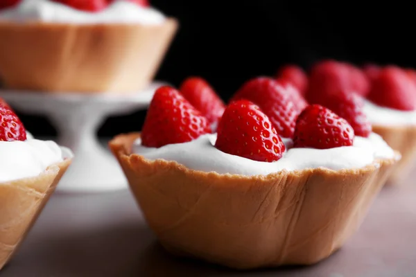 Tasty cake with strawberries, closeup