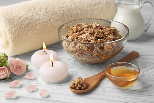 Body scrub, honey and cosmetics on wooden background