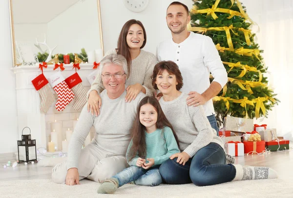 Happy family in living room decorated for Christmas