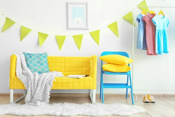 Modern room interior with yellow sofa