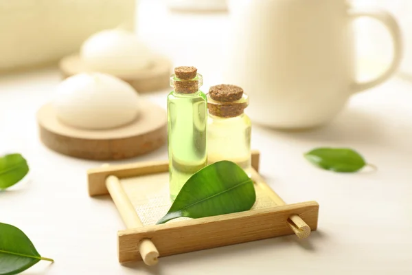 Spa composition with tea tree oil on white background