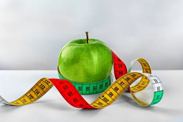 Dieting concept with measuring tape