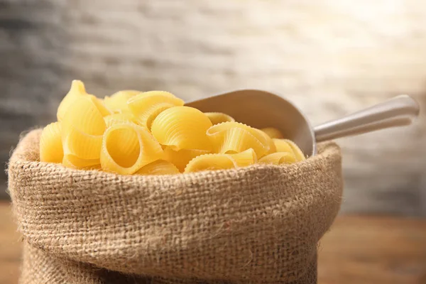 Metallic scoop with pasta