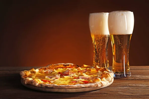 Tasty pizza with beer