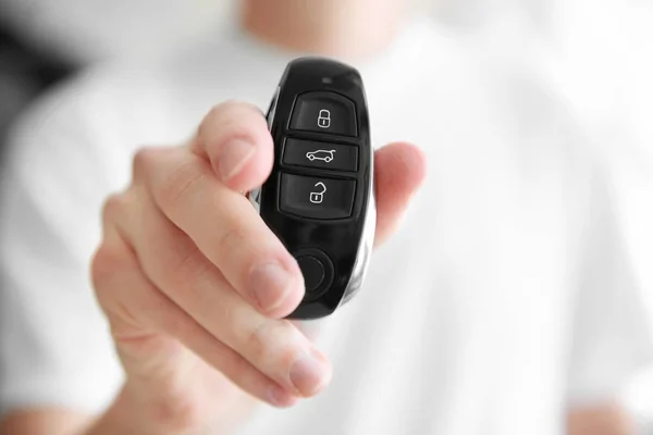 Man holding car remote control