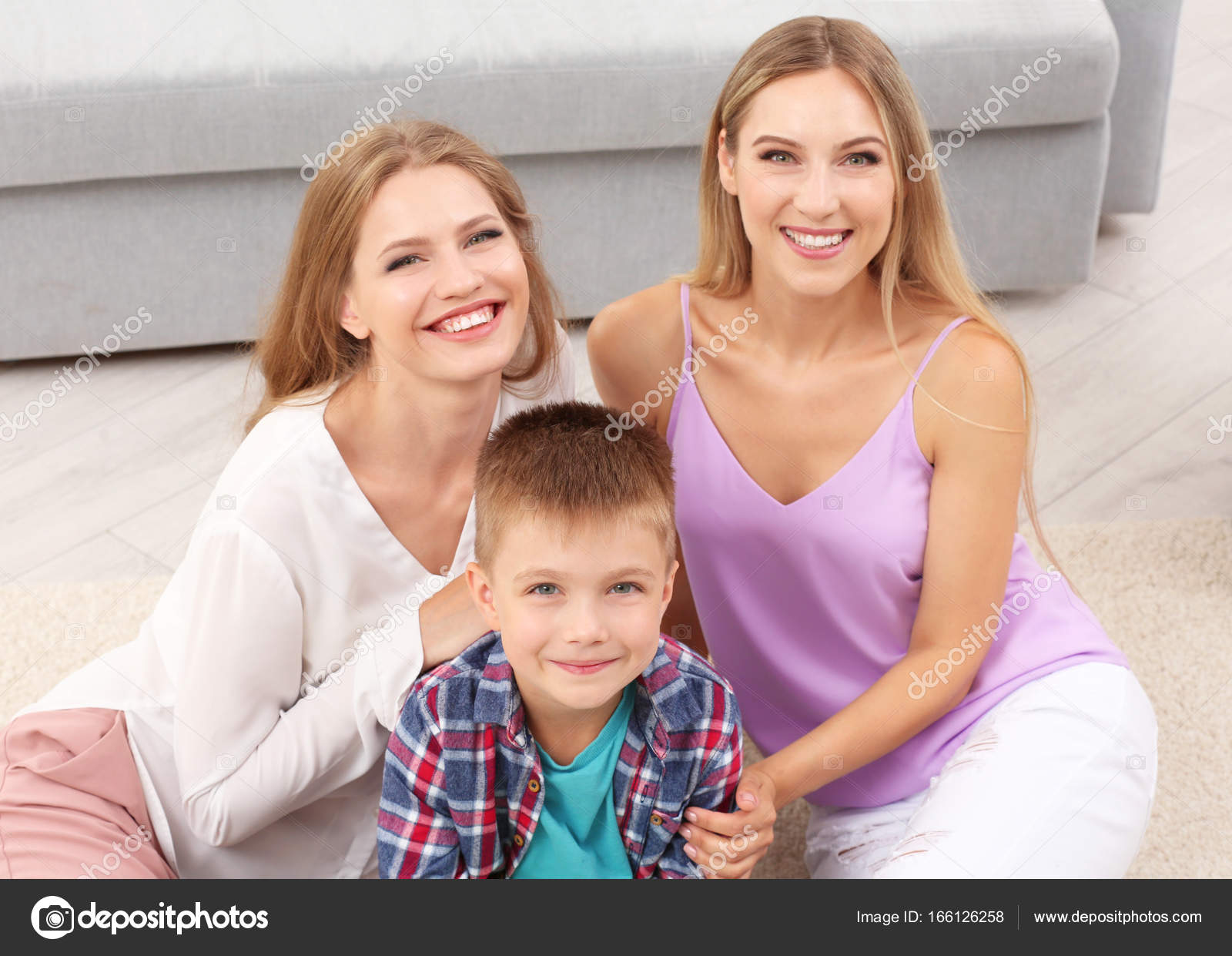 Lesbian Couple With Foster Son Stock Photo By Belchonock