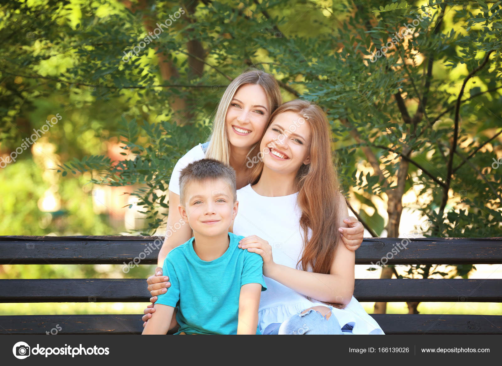 Lesbian Couple With Foster Son Stock Photo Belchonock