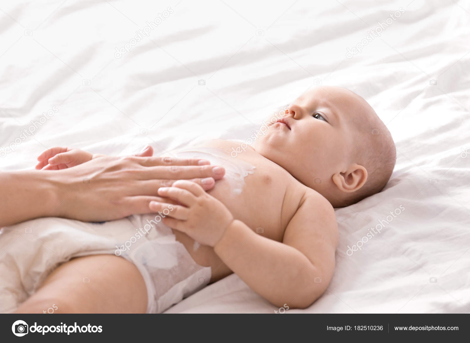 Little boy puts too much body lotion on her