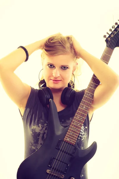 Blonde girl with electric guitar.