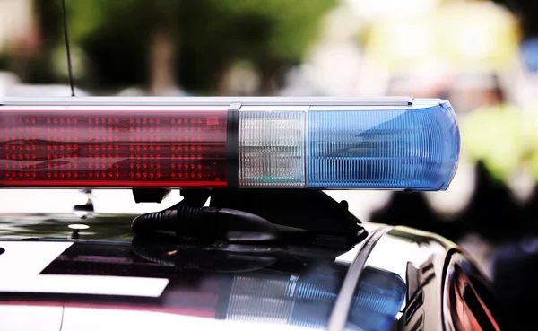 Red and blue flashing lights of the police car at the checkpoint