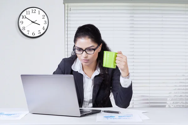 Busy businesswoman enjoy coffee and working