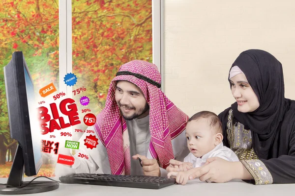 Arabic family with computer at home