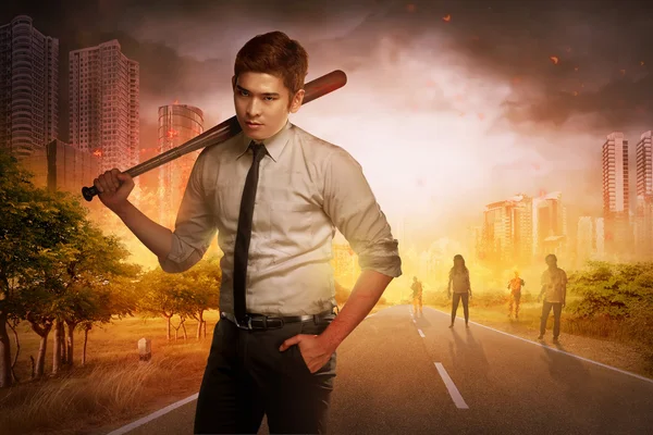 Man with baseball bat against zombies