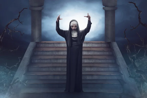 Devil asian nun walks down the ruins stairs