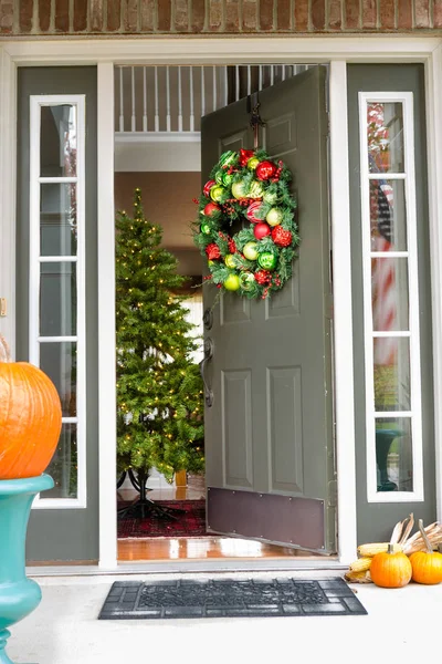Open doorway to an inviting Christmas scene