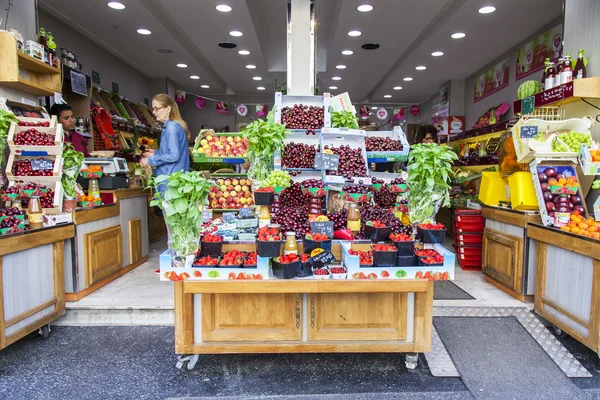 PARIS, FRANCE, on JULY 10, 2016. Various fresh fruit and vegetables lie on a show-window of shop
