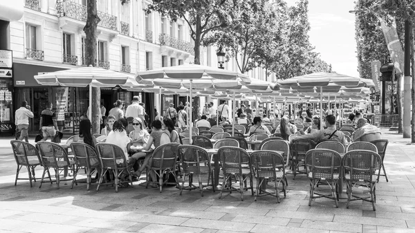 PARIS, FRANCE, on JULY 9, 2016. Champs Elyse. People eat and have a rest in cafe under the open sky.