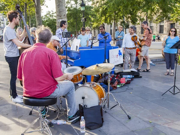 PARIS, FRANCE, on JULY 10, 2016. Musicians fans play under the open sky on the Area of the Republic.
