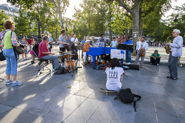 PARIS, FRANCE, on JULY 10, 2016. Musicians fans play under the open sky on the Area of the Republic.