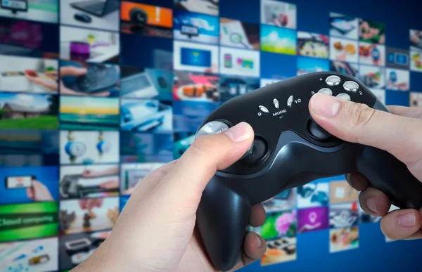 Gamer holding game pad in hands. Game play controller with streaming multimedia