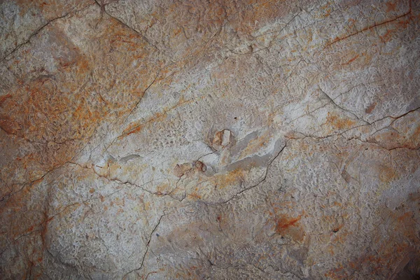 Stone surface of orange and grey color