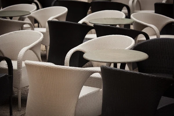 Black and white tables and chairs in the restaurant