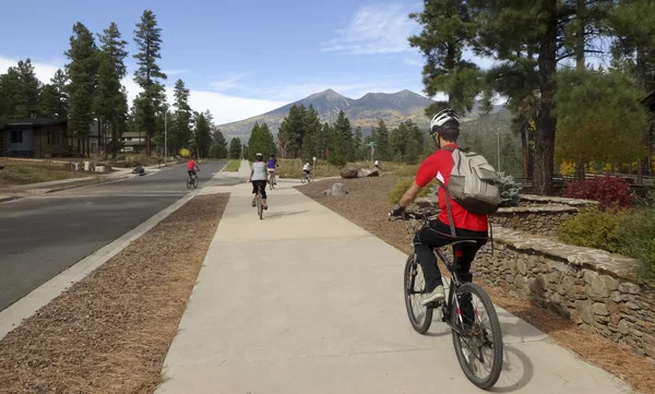 A Cyclist Family Rides in the Fall