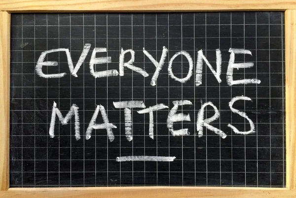Everyone Matters written on a Blackboard