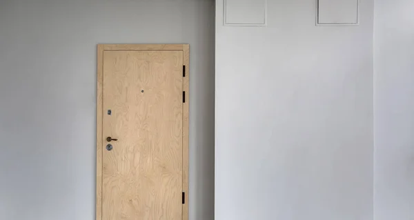 Wall with wooden door