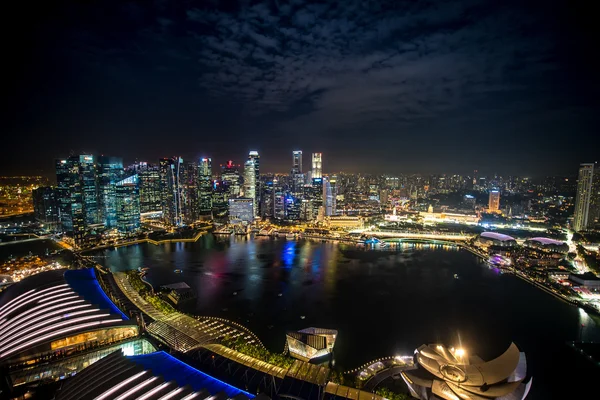 SINGAPORE - September 2016: Skyscrapers in financial district of Singapore, skyline view from Marina Bay Sands. Singapore Marina Bay rooftop view with urban skyscrapers at night.