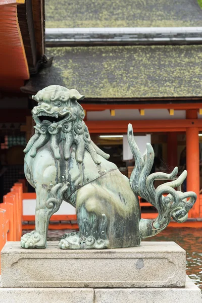 Open mouth lion at itsukushima Shinto Shrine.