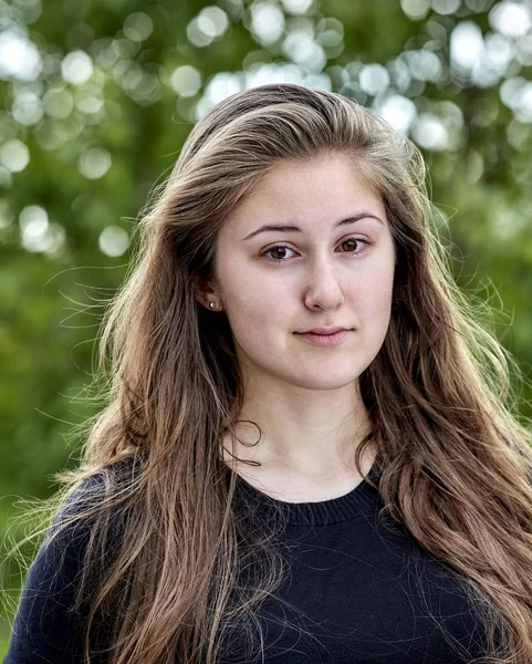 Young woman with long hair ready to cry