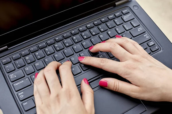 Close up of a Womans Hands on Keyboard