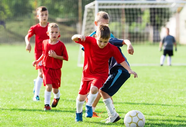 Boys kicking ball