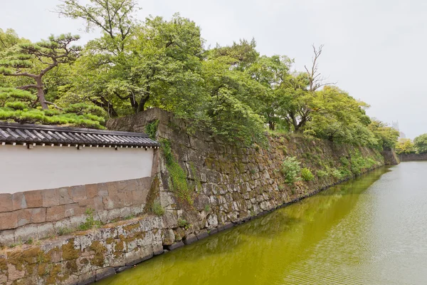 Moat and stone walls of Wakayama castle, Japan