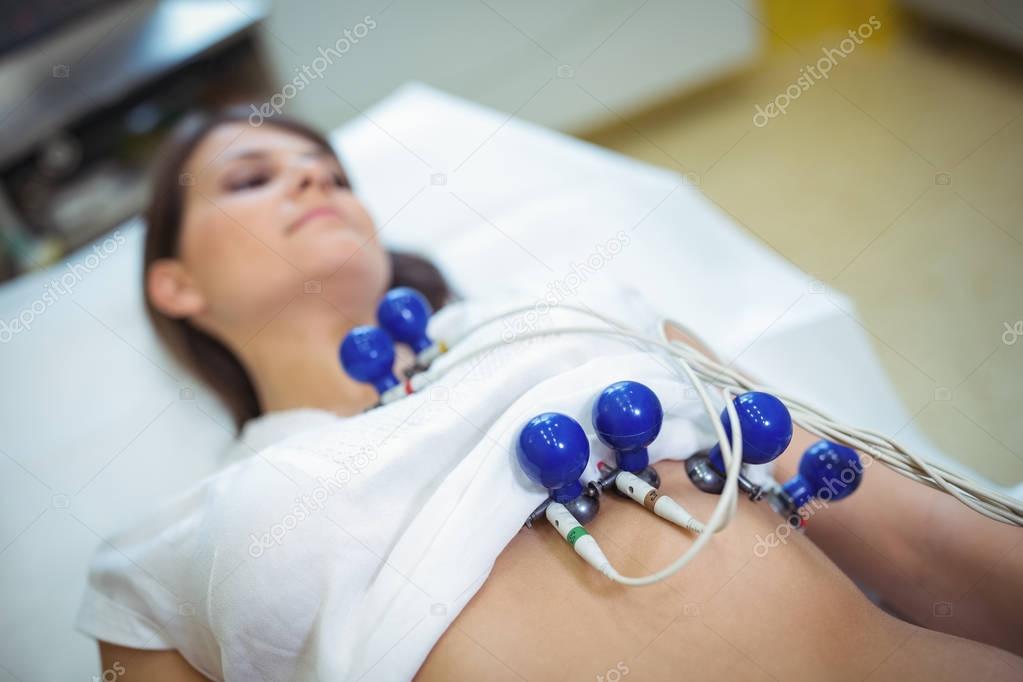 Female Patient Undergoing An Electrocardiogram Test Stock Photo