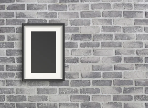 Blank frame on grey birck wall