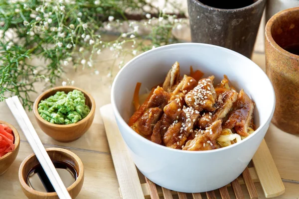 Japanese food chicken katsu don served with soy sauce