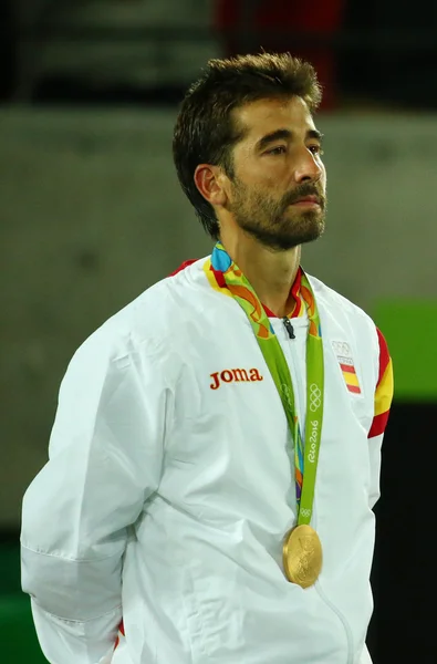 Olympic champion Mark Lopez of Spain during medal ceremony after victory at men's doubles final of the Rio 2016 Olympic Games