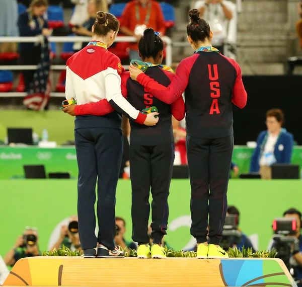 Women\'s all-around gymnastics medalists at Rio 2016 Olympic Games Aliya Mustafina of Russia (L),Simone Biles of USA and Aly Raisman of USA during medal ceremony