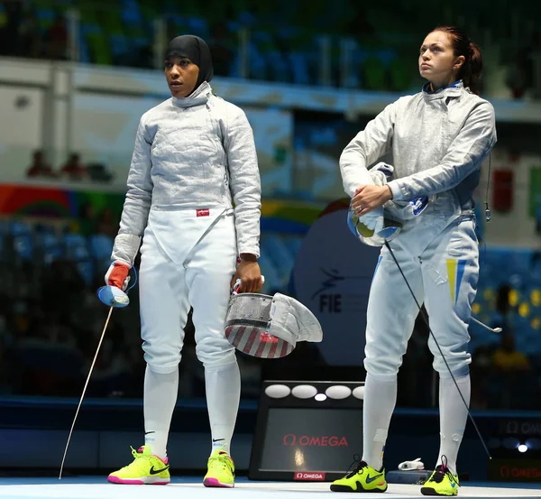 Ibtihaj Muhammad of United States (L) and Olena Kravatska of Ukraine competes in the Women\'s individual sabre of the Rio 2016 Olympic Games