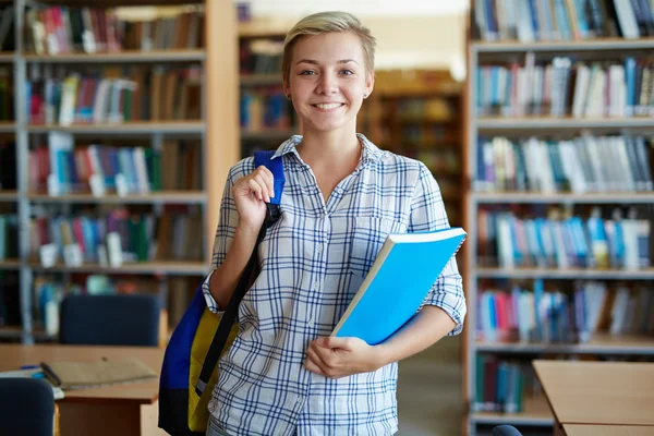 Attractive student in library