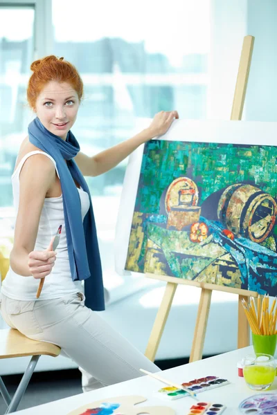 Young artist with her picture