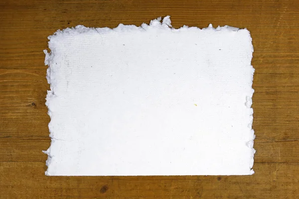White handmade paper on wooden background
