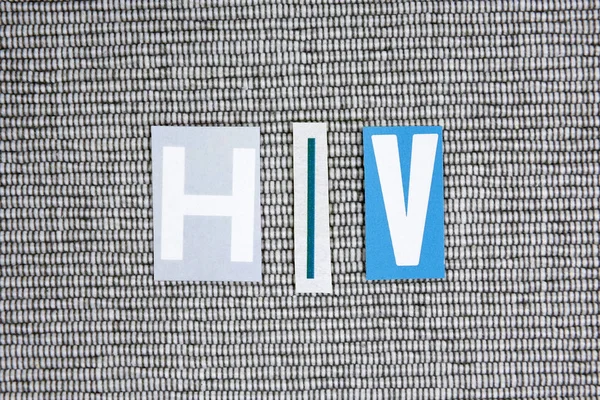 HIV (Human Immunodeficiency Virus) acronym on grey background