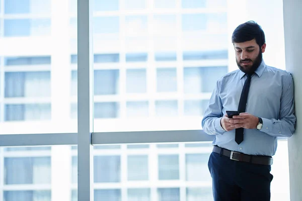 Businessman standing by window