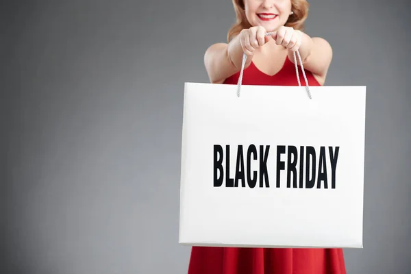 Woman holding bag with Black Friday