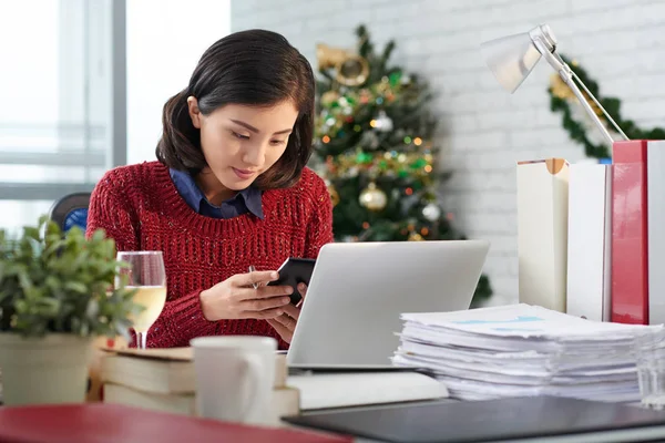 Business lady busy with work on Christmas