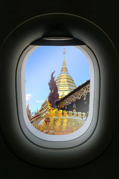 The window of airplane with travel destination attraction. Chian